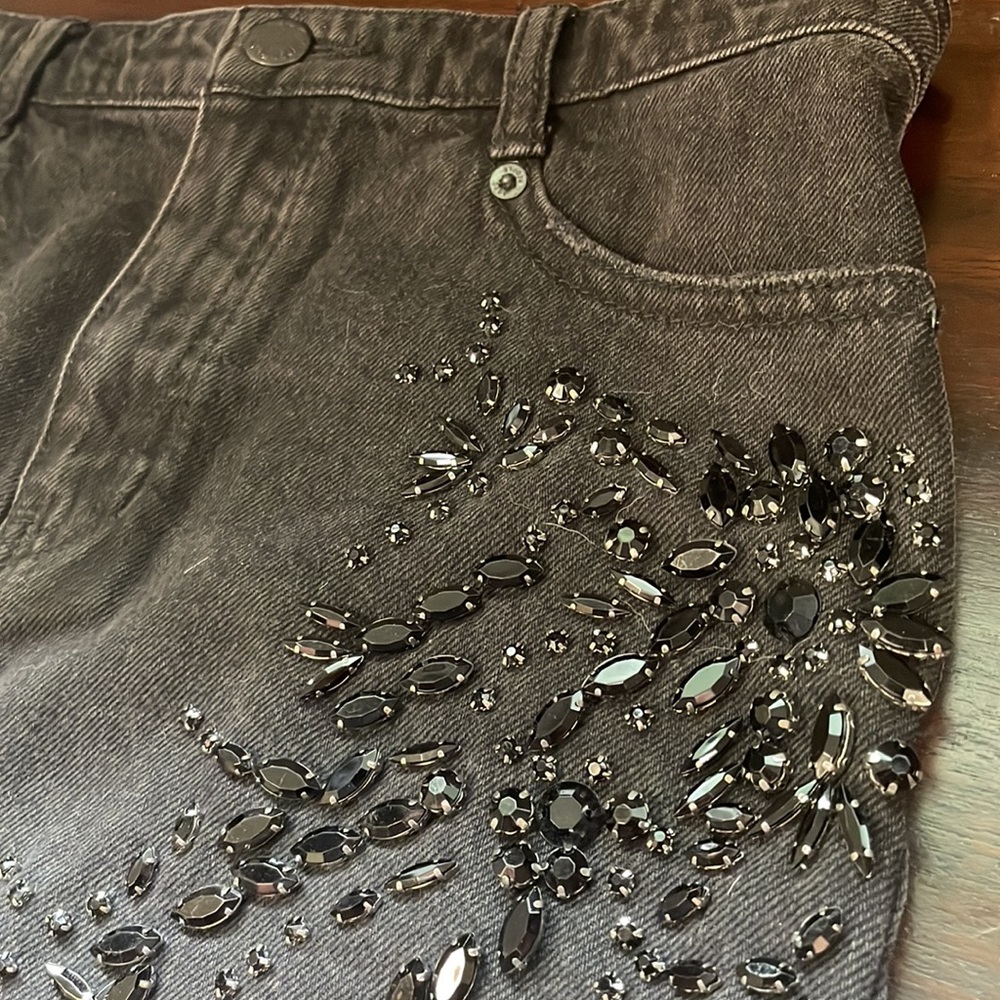 Like new Free People black jean mini shirt with rhinestones. Size 2
